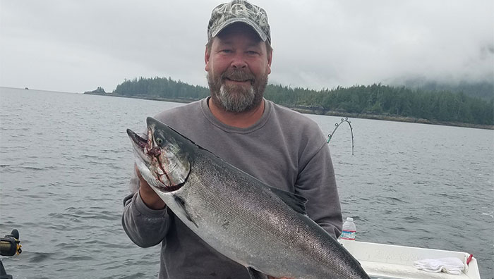 Captain Holding King Salmon